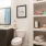 well lit bathroom with buit-in shelving