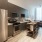 open kitchen next to living room with massive window