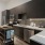 under cabinet lighting and beautifully tiled backsplash in spacious kitchen