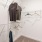 lighted walk-in closet with built-in shelving