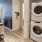 stacked waher/dryer across from kitchen